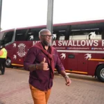 Coach on his way to the match.