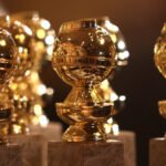 Three Golden Globe trophies