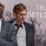 True detective poster with a cloudy enivironment, bare trees and two men walking