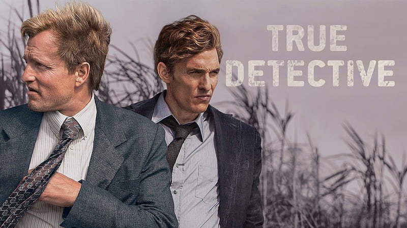 True detective poster with a cloudy enivironment, bare trees and two men walking