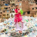 woman standing on plastic trash