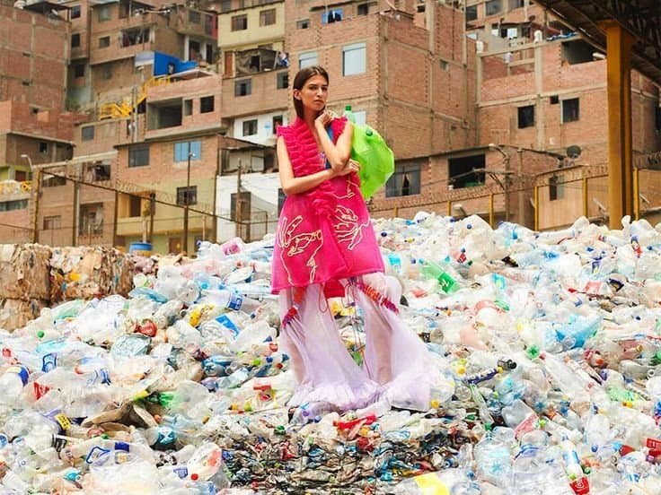 woman standing on plastic trash