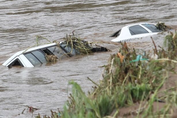 Flooded street with the two cars sinking