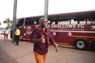 Coach on his way to the match.