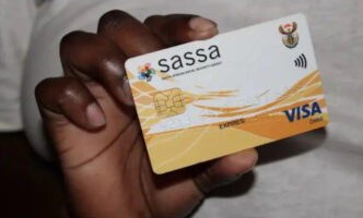 hand holding sassa card
